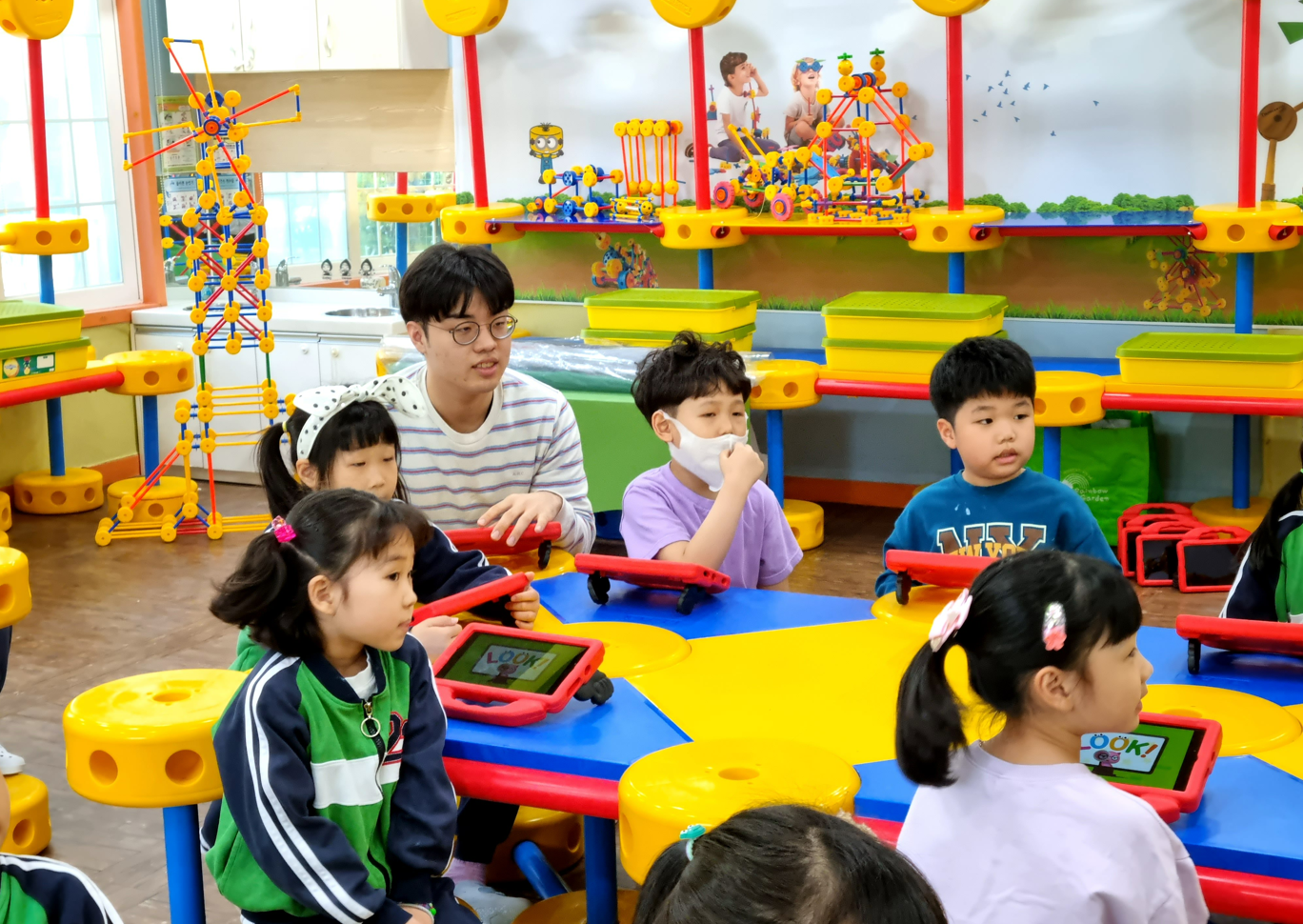 Classroom with building materials and tablets